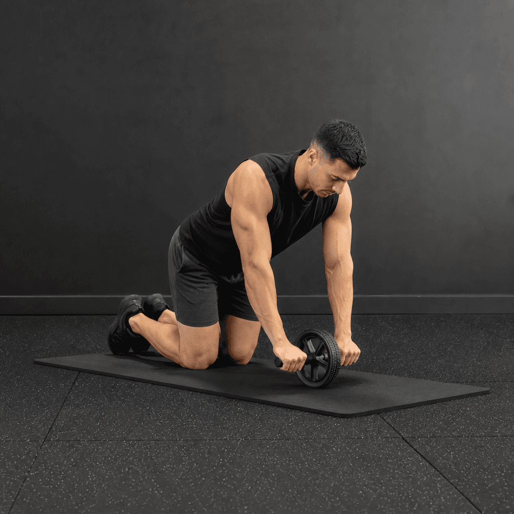 Ab Wheel Rollout: male athlete, frame 1, safe kneeling setup with the wheel below the shoulders.
